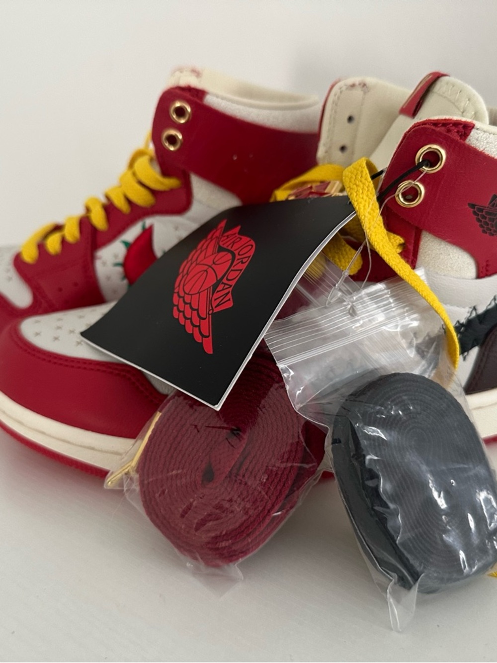 Jordan Women’s High-Top Sneakers in Red, White, Yellow, Black